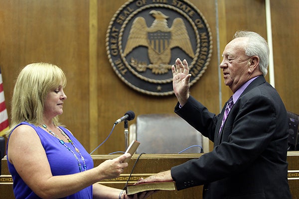 Chief Deputy Chancery Clerk Beverly Johnson swears in interim Circuit Clerk Greg Peltz Tuesday in the circuit courtroom at the Warren County Courthouse. (Justin Sellers/The Vicksburg Post)
