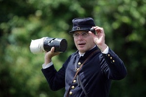 David Slay, a member of Stanford's Mississippi Battery displays a type of cannon ammunition Saturday during a demonstration at the Vicksburg National Military Park. (Justin Sellers/The Vicksburg Post)