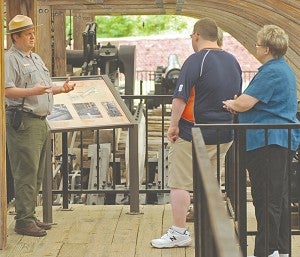 U.S. Park Ranger Ray Hamel explains to visitors, on the tour, how the Cairo's enigines operated. 