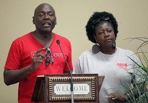 Luke Versher, left, and Valencia Robinson speak Saturday during the Wake Up Youth Rally, which is used to raise awareness of HIV, AIDS and other issues facing youth in community at Greater Grove Street Missionary Baptist Church.