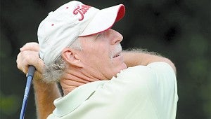 Mark White keeps his eye on the ball after teeing off on the 5th hole.