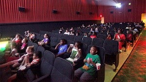 Movie-goers watch Free Birds Wednesday morning during the Wilcox Cinema Summers Kids Film Festival at the Vicksburg Mall.