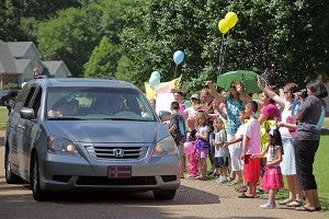 More than 100 supporters welcomed Afton Wallace, 17, to her home on Pebble Beach Drive Tuesday. Wallace, who was diagnosed May 22 with Ewing's sarcoma, a cancerous bone tumor that only affects children, has been receiving treatment at Vanderbilt Children's Hospital in Nashville since Memorial Day. (Justin Sellers/The Vicksburg Post)