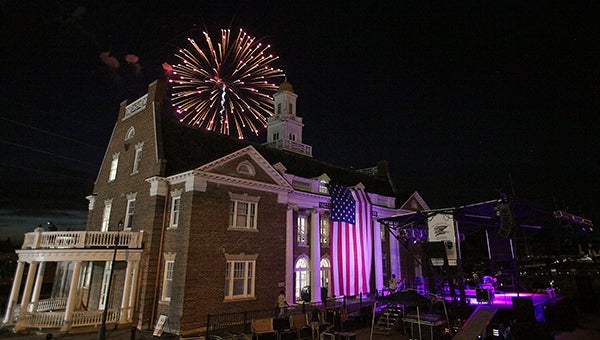 Fireworks explode behind the Old Depot Museum Friday during the annual Fourth of July celebration in Vicksburg following a concert by Chicago-tribute band Dialogue.