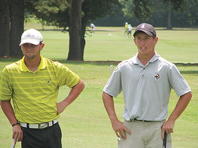Chris Whittington, left, and Parker Rutherford stand next to each other during the final round of the 2013 Warren County Championship. Whittington won the tournament for the third straight year, and will go for his fourth in a row this weekend at Clear Creek Golf Course. (Ernest Bowker/The Vicksburg Post)