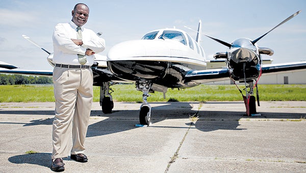 Vicksburg Municipal Airport director Sam Washington stands in front of a plane in May. (Justin Sellers/The Vicksburg Post)
