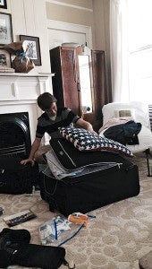 Jack Richardson packs his suitcase Wednesday before leaving home for Germany.