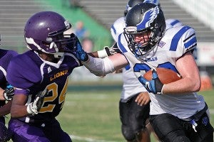 Porters Chapel running back Hunter Lyons stiff-arms Union Christian’s Corey Mason during Friday’s Red Carpet Bowl. PCA won, 34-26. (Justin Sellers/The Vicksburg Post)