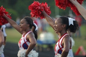 Warren Central cheerleading captain Kennedy Whitmore, 17, leads the squad in a cheer Friday evening during the annual Red Carpet Bowl at Memorial Stadium. (Justin Sellers/The Vicksburg Post)