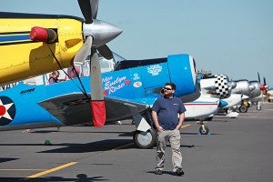 Vicksburg native McLain Walker checks out a row of airplanes Friday during the Southern Heritage Air Show at Vicksburg-Tallulah Regional Airport. (Justin Sellers/The Vicksburg Post)