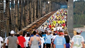 Hundreds of runners and walkers make their way across the old U.S. 80 bridge during the Over the River Run held Oct. 11.  (Justin Sellers/The Vicksburg Post)