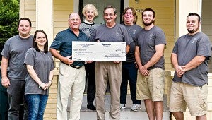 VOLUNTEER: Bob Moss, center, volunteers with Habitat for Humanity and Service Over Self. (David Rorick / For The Vicksburg Post)