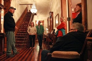 Guide Morgan Gates, left, gives a Haunted Vicksburg tour Wednesday night at the Baer House on Grove Street. (Justin Sellers/The Vicksburg Post)