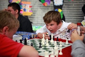 Brandon Turner, a sixth-grader at Redwood, makes a face to intimidate his opponent in a game of chess Saturday during Vicksburg-Warren School District's Showcase of Schools at the Vicksburg Mall. (Justin Sellers/The Vicksburg Post)