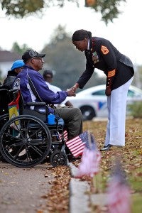 Marine Gunnery Sgt. Michelle Stewart shakes hands with World War II veteran Charles Alexander Tuesday morning before the Veterans Day ceremony at the Rose Garden. (Justin Sellers/The Vicksburg Post)