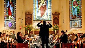 Conductor Crafton Beck leads the Mississippi Symphony Orchestra during the Four Season of the Arts Masters by Candlelight Series.
