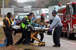 Emergency responders transport a Warren County man to an ambulance after the car he was driving struck an 18-wheeler Thursday morning on the westbound lane of Interstate 20 near the U.S. 61 N. exit. The wreck backed up traffic on I20 well into the night. (Justin Sellers/The Vicksburg Post)