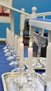 LIGHT A CANDLE: Candles burn in a Hanukia as a celebration of Channukah. (Paul Barry•The Vicksburg Post)