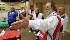 TALKING STRATEGY: Richard Van Den Akker leads volunteers through training exercises Saturday morning as the American Red Cross staged a mock disaster relief shelter at Hawkins United Methodist Church. (Justin Sellers/The Vicksburg Post)
