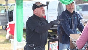 BECKONING: River Region executive chef John Pelton beckons someone to try his chili Saturday.