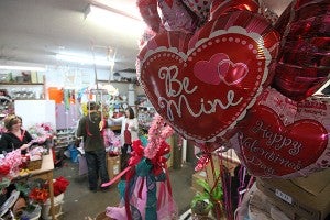 Flowers and decorations fill the back room of The Ivy Place Thursday afternoon in preparation for Valentines Day. (Justin Sellers/The Vicksburg Post)