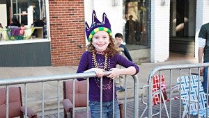 QUEEN OF CARNAVAL: Mia Abdo, a kindergartner at Porters Chapel Academy and the daughter of Tiffany and James Abdo waits for the Mardi Gras to begin Saturday. 