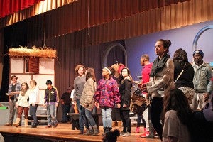 Warren Central students perform a scene Thursday night during a rehearsal of "Beauty and The Beast" in the WC auditorium. (Justin Sellers/The Vicksburg Post)