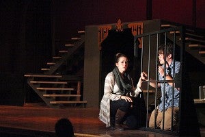 Becca English, playing Belle, and Ryan Wilcox, playing Maurice, perform Thursday night during a rehearsal of "Beauty and The Beast" in the Warren Central auditorium. (Justin Sellers/The Vicksburg Post)