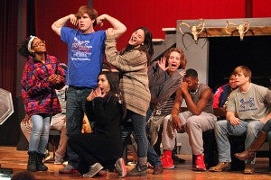 Dennis Lewis, playing the part of Gaston, is surrounded by admirers Thursday night during a rehearsal of "Beauty and The Beast" in the Warren Central auditorium. (Justin Sellers/The Vicksburg Post)