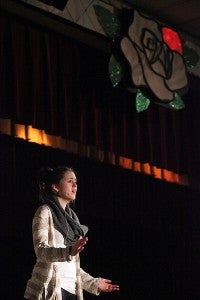 Becca English, playing Belle, performs Thursday night during a rehearsal of "Beauty and The Beast" in the Warren Central auditorium. (Justin Sellers/The Vicksburg Post)