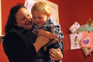 MEDICAL MARVEL: Twenty-three-month-old Richie Southard, who has Type 1 diabetes, laughs while hugging his mother Erin Southard at their home.