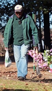 Gravedigger John Nickerson walks among the graves at Greenlawn Gardens Cemetery. (Justin Sellers/The Vicksburg Post)