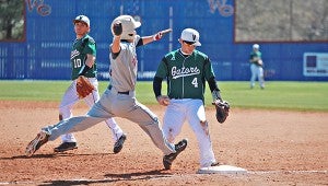 Vicksburg High first baseman Taylor Hollowell (4) steps on the bag for an out as Lewisburg’s Jake Tyrone runs down the line in the seventh inning Saturday. (Ernest Bowker/The Vicksburg Post)