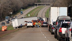 TRAFFIC CONGESTION: Shorter’s Towing employees attempt to pull an 18-wheeler out of the median Friday afternoon in the eastbound lane of Interstate 20 near Bovina after the vehicle lost control due to weather-related conditions, Mississippi Highway Safety Patrol spokesman Eric Henry said. No injuries were reported at the time of the crash, Henry said. 