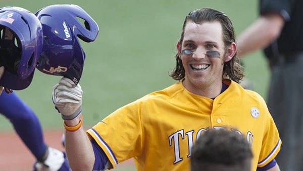 LSU’s Conner Hale celebrates with teammates after scoring a run in Sunday’s 18-6 rout of Ole Miss. Hale went 2-for-3 with a home run, two RBIs and three runs scored. (Kyle Zedaker/LSUSports.net)