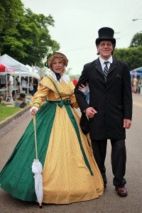 AUTHENTIC: Minnesota residents Tracey and Steve Glomstad dress in period clothing Saturday during the Old Court House Flea Market. 