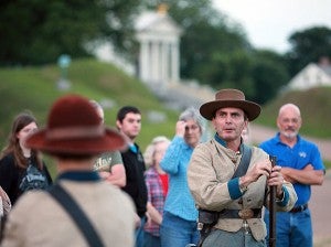 HISTORY ALIVE: Park ranger Dr. David Slay, dressed as a 3rd Louisiana Infantry soldier, speaks to a group of visitors Saturday evening during the Shadows of the Past candlelight tour at the Vicksburg National Military Park. (Justin Sellers/The Vicksburg Post)