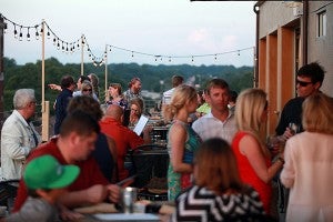 Diners enjoy their dinner at 10 South Rooftop Bar and Grill Monday evening during the second night of their soft opening. The rooftop restaurant is opening to the public Wednesday. 