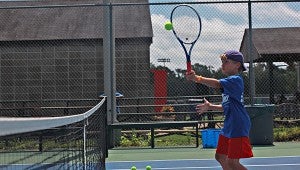 Gordon Wilkerson hits a shot at the net during the City of Vicksburg’s summer tennis camp at Halls Ferry Park. (Ernest Bowker/The Vicksburg Post)