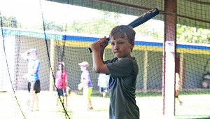 Ethan Patrick, 6, prepares to hit in the batting cage during Warren Central’s annual “Home of Champions” youth baseball camp Wednesday at Viking Field. The weeklong camp for children in grades 1-8 concludes on Thursday. (Ernest Bowker/The Vicksburg Post)