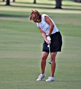 Dinah Lazor chips toward the ninth green Wednesday during her round with the Clear Creek Ladies Golf Association. (Ernest Bowker/The Vicksburg Post)