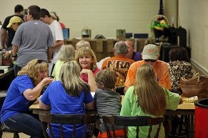 Visitors eat their pulled pork plates Saturday during a benefit lunch for Vicksburg Police officer Burt Ryan at BPOE #95 Elks Lodge. (Justin Sellers/The Vicksburg Post)