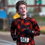 Luke Beissel heads down the home stretch of the Chill in the Hills 10K run Saturday. Beissel, a 12-year-old from Grenada, won the race with a time of 41:24. (Ernest Bowker/The Vicksburg Post)