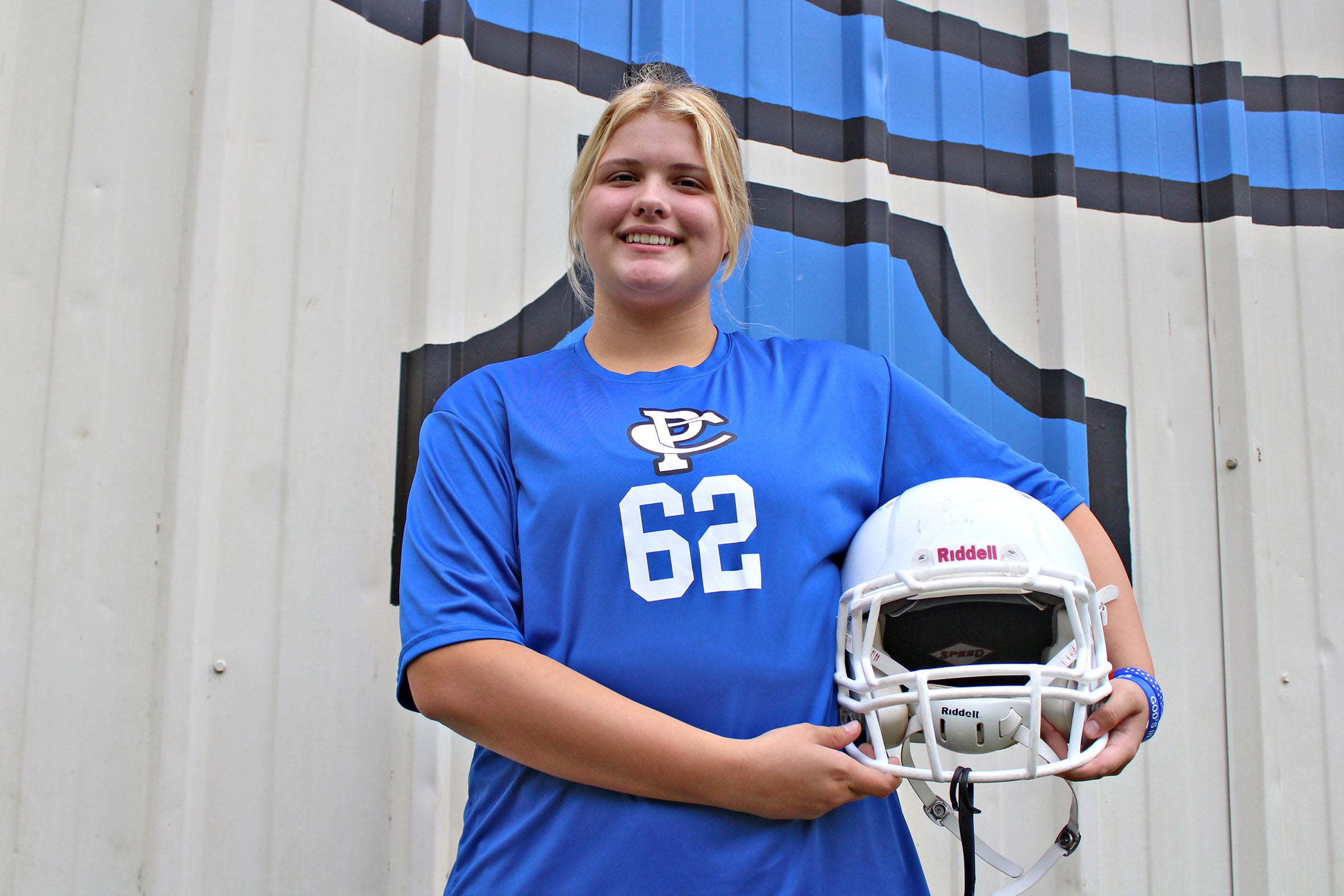 Female American Football Player in Uniform and Jersey T-shirt