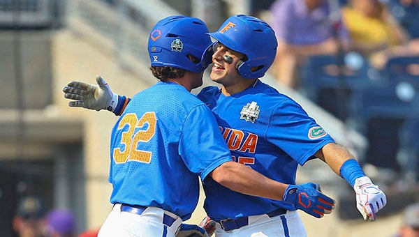 LSU nips Florida in 11 innings in Game 1 of College World Series